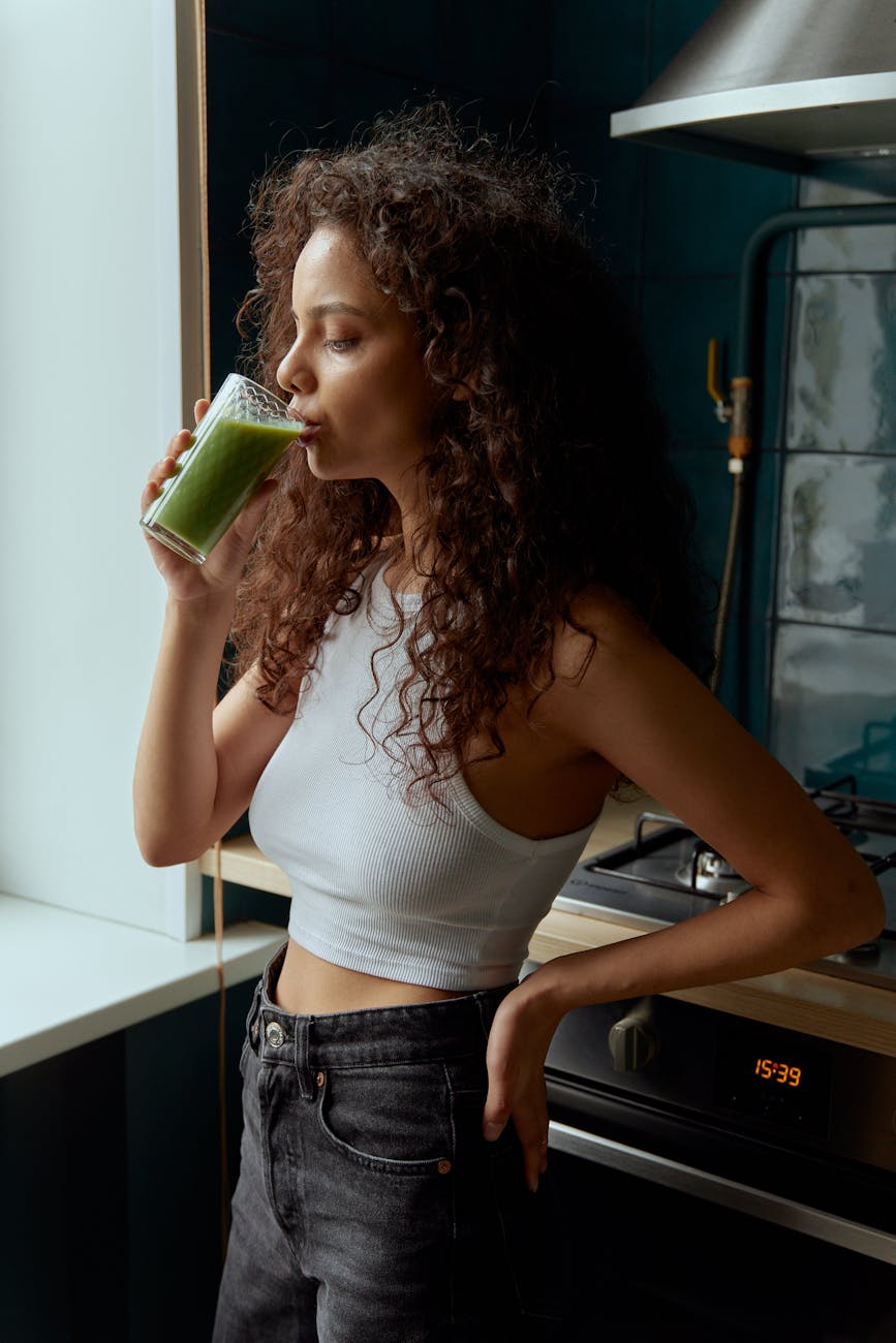 a woman drinking a healthy drink
